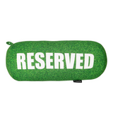 Fisura grass cushion labeled "reserved" with a natural green grassy design, ideal for home decor or outdoor seating.