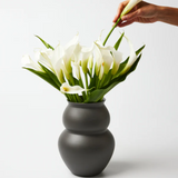 Jones & Co Happy Vase Wide Stormy, a stylish ceramic vase with a wide opening and stormy blue finish, perfect for floral arrangements.