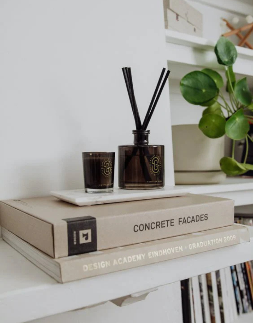 Scarlet & Grace Egyptian Oud diffuser in a 220ml glass bottle with reed sticks, showcasing elegant design and warm scent.
