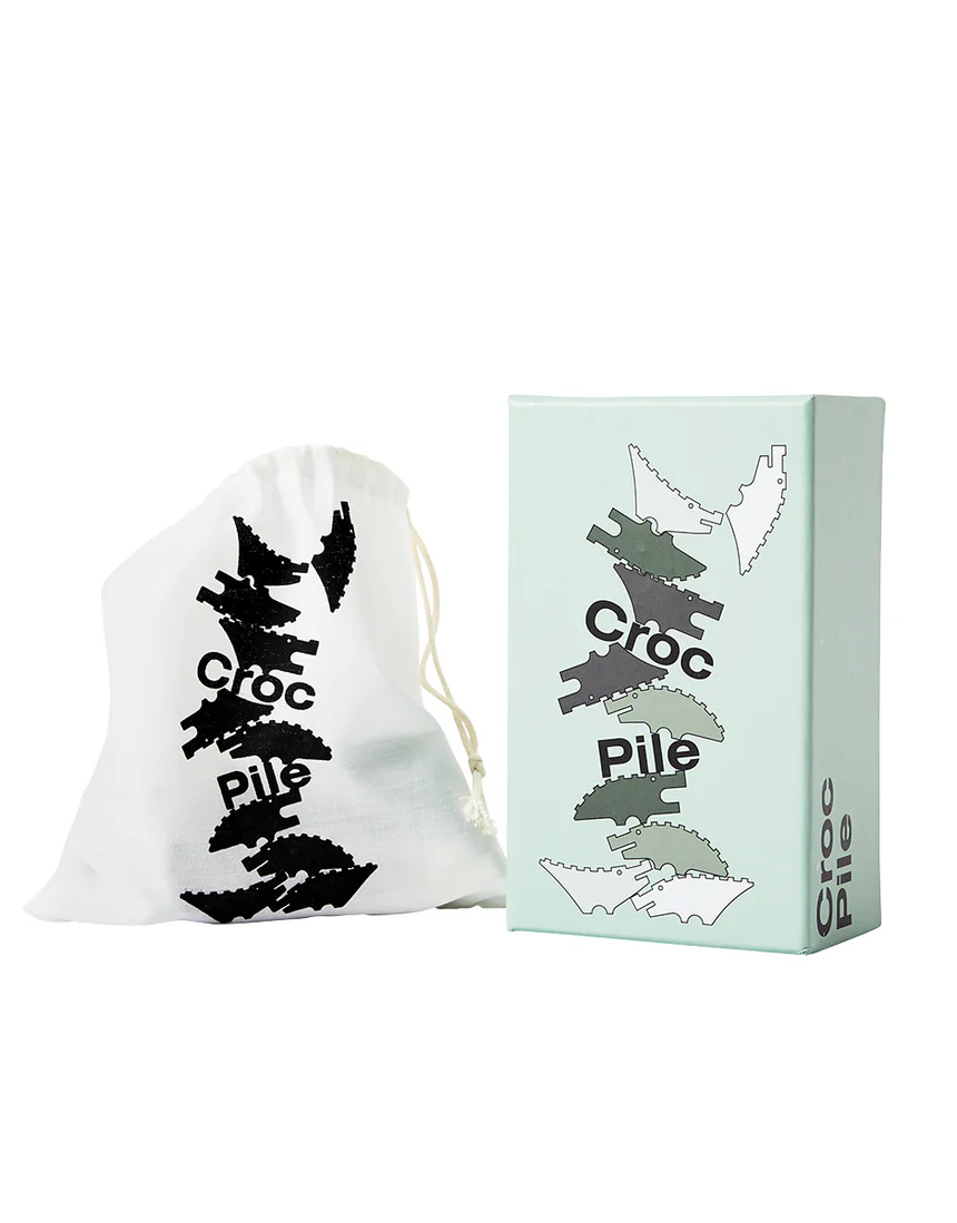 Areaware Croc Pile Mini kids' plush toy in green with textured croc pattern, soft and colorful for children.