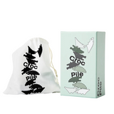Areaware Croc Pile Mini kids' plush toy in green with textured croc pattern, soft and colorful for children.