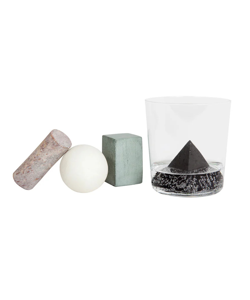 Areaware drink rocks shaped like various geometric figures, used to chill beverages in style.