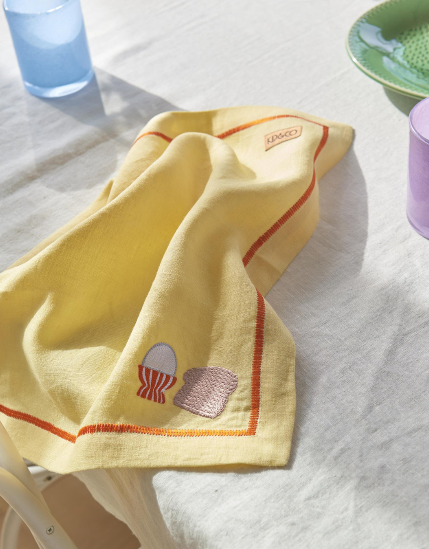 Kip & Co embroidered linen 4-piece breakfast napkin set, featuring decorative designs on soft fabric for stylish table setting.
