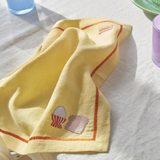 Kip & Co embroidered linen 4-piece breakfast napkin set, featuring decorative designs on soft fabric for stylish table setting.