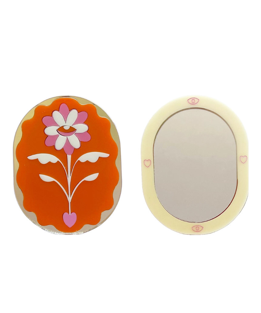 Stof Studios Eden pocket mirror with orange and gold design, compact and stylish accessory for on-the-go reflection.