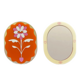 Stof Studios Eden pocket mirror with orange and gold design, compact and stylish accessory for on-the-go reflection.