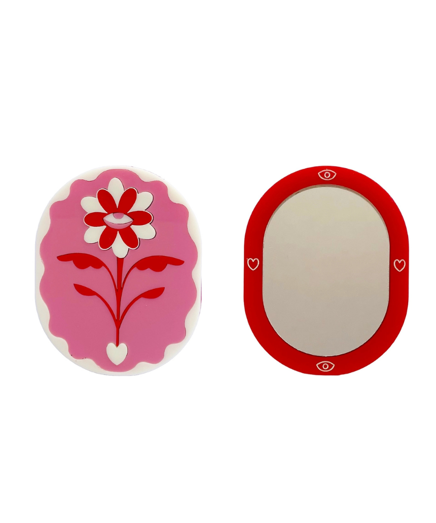 Pink and red Eden pocket mirror by Stof Studios featuring a compact, stylish design with a reflective surface.