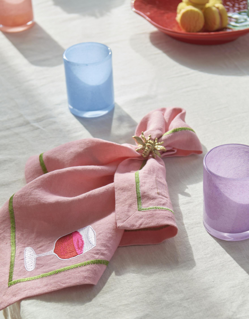 Kip & Co Supper Club embroidered linen napkin set with four colorful, stylish napkins featuring intricate embroidery details.