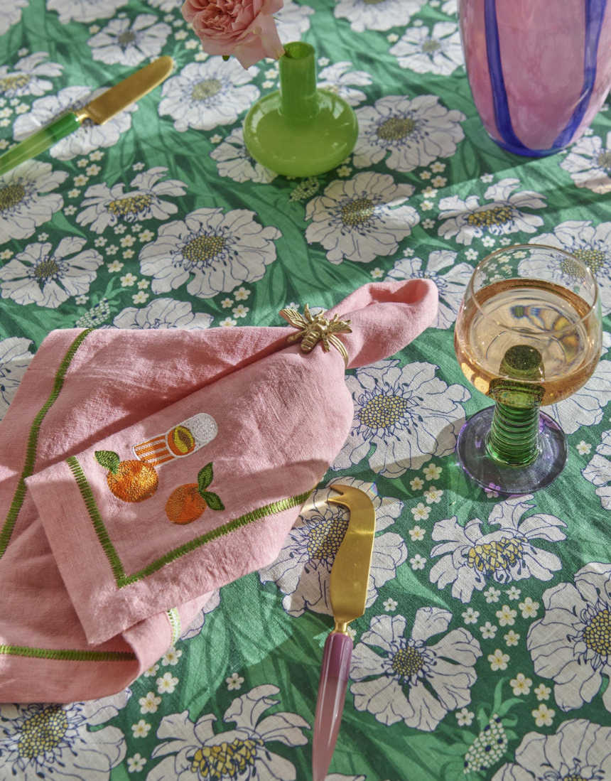 Kip & Co embroidered linen napkin set with colorful supper club design, four-piece table linen for elegant dining.