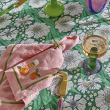 Kip & Co embroidered linen napkin set with colorful supper club design, four-piece table linen for elegant dining.