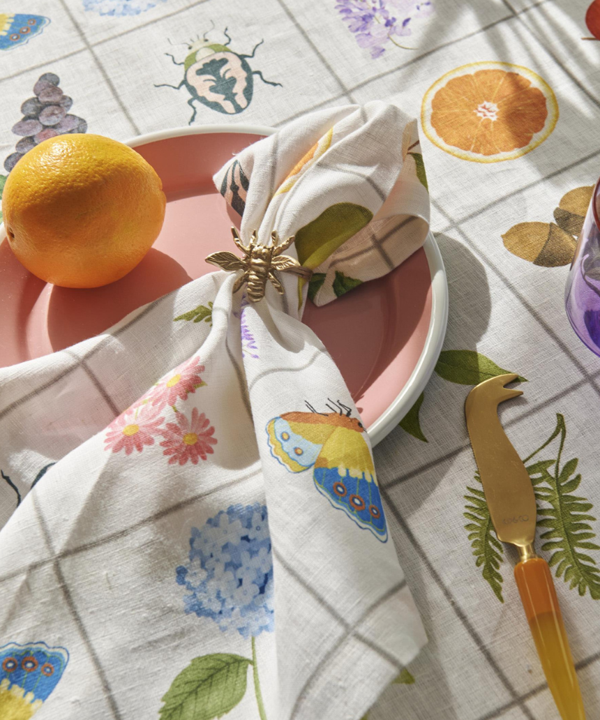 Kip & Co Prairie Linen 4-piece napkin set featuring soft, textured linen fabric with a floral pattern for dining decor.