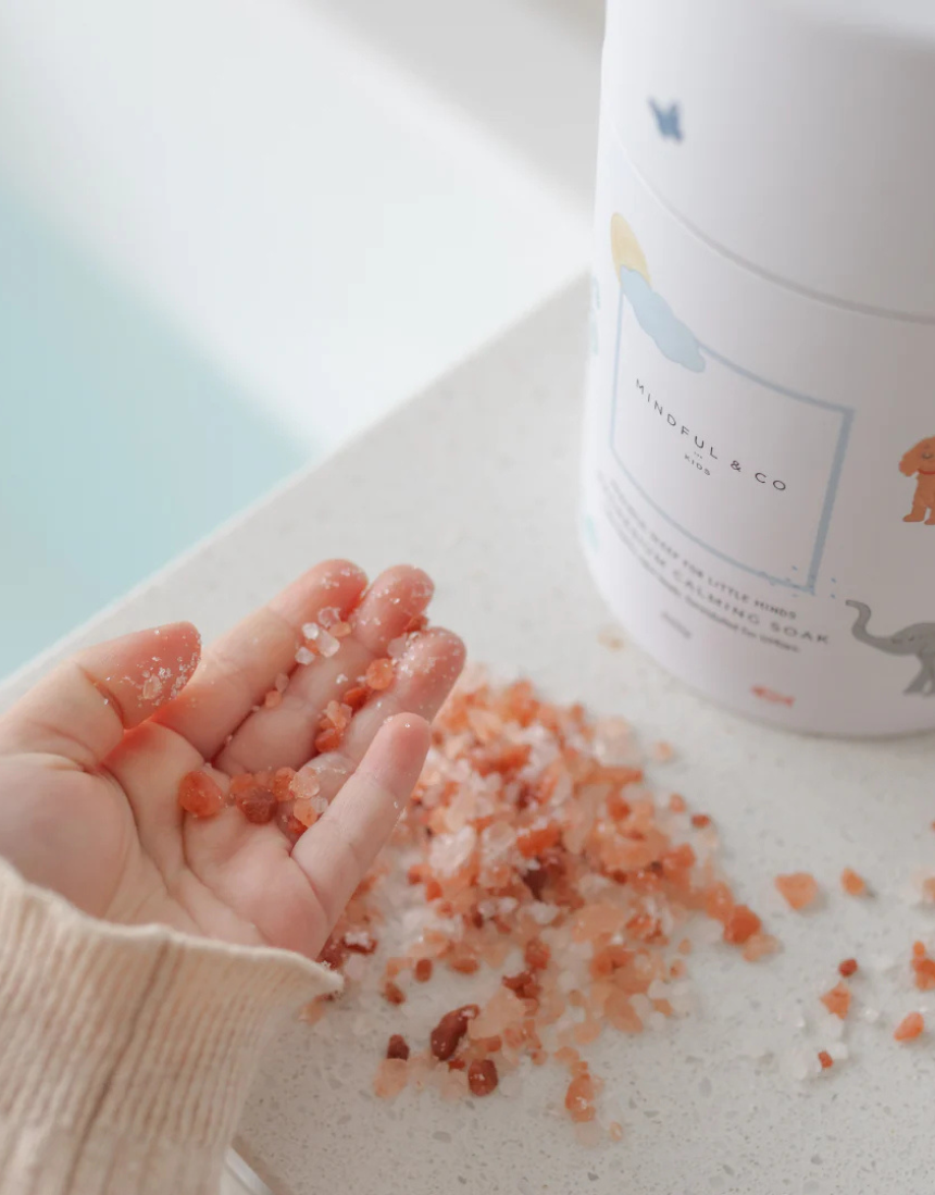 Kids magnesium calming soak bath additive from Mindful and Co Kids, showing a bottle of relaxing bath product for children.