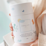 Mindful and Co Kids magnesium calming soak bath additive with calming ingredients, in a clear bottle with label and bath salts.
