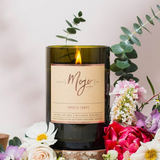 Mojo Candle Co. Garden Party candle with floral design, featuring a glass jar and a white wax interior.