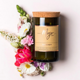 Mojo Candle Co. Garden Party candle with floral design and warm glow, showcasing a beautifully crafted aromatic candle.