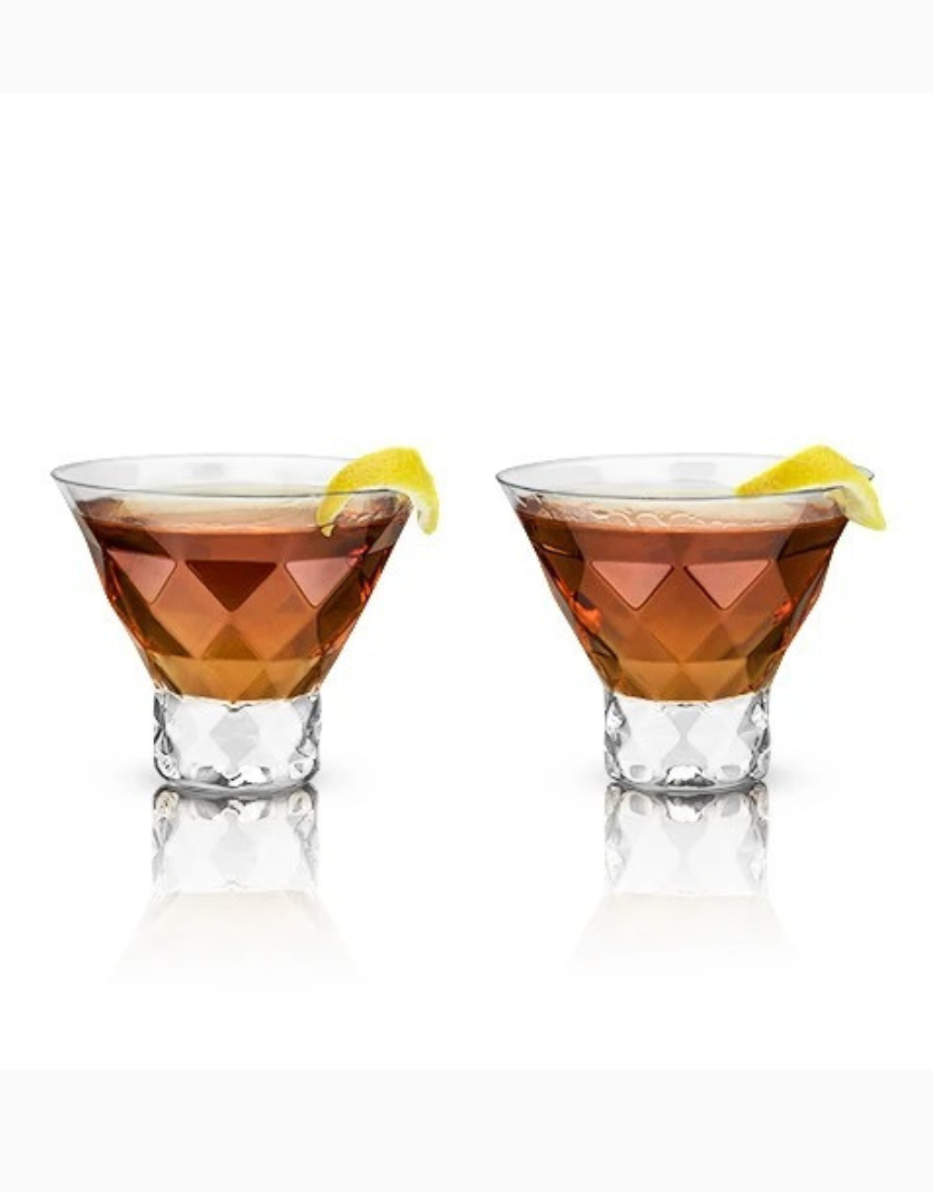 Two clear Viski Gem Crystal Martini glasses with intricate cut designs on a reflective surface.