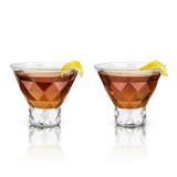 Two clear Viski Gem Crystal Martini glasses with intricate cut designs on a reflective surface.