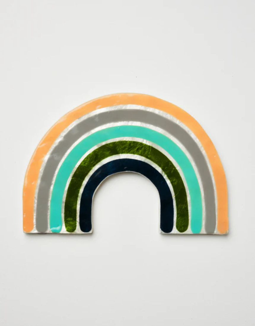 Jones & Co Golden Rainbow Pink wall decor featuring a vibrant rainbow design on a decorative wall hanging.