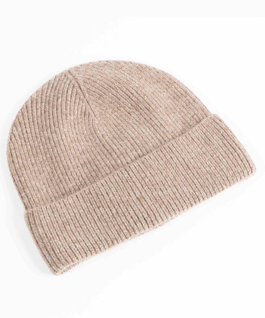 Maison Fanli Auguste beige beanie, soft knit hat shown on a model, stylish and cozy winter accessory.