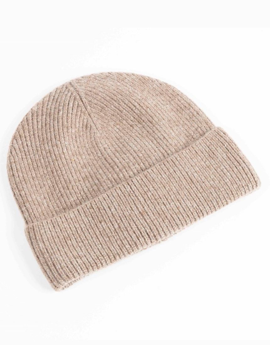 Maison Fanli Auguste beige beanie, soft knit hat shown on a model, stylish and cozy winter accessory.