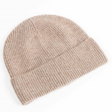 Maison Fanli Auguste beige beanie, soft knit hat shown on a model, stylish and cozy winter accessory.