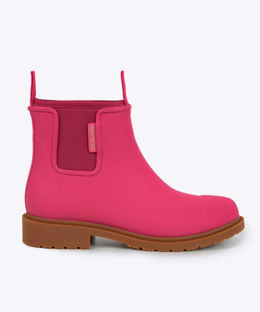 Fuchsia pink Merry People Bobbi gumboots with black soles, waterproof rubber footwear for rainy weather.
