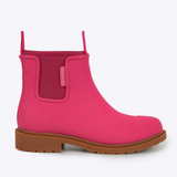 Fuchsia pink Merry People Bobbi gumboots with black soles, waterproof rubber footwear for rainy weather.