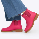 Fuchsia pink Merry People Bobbi gumboots with black soles, waterproof rubber rain boots for women.