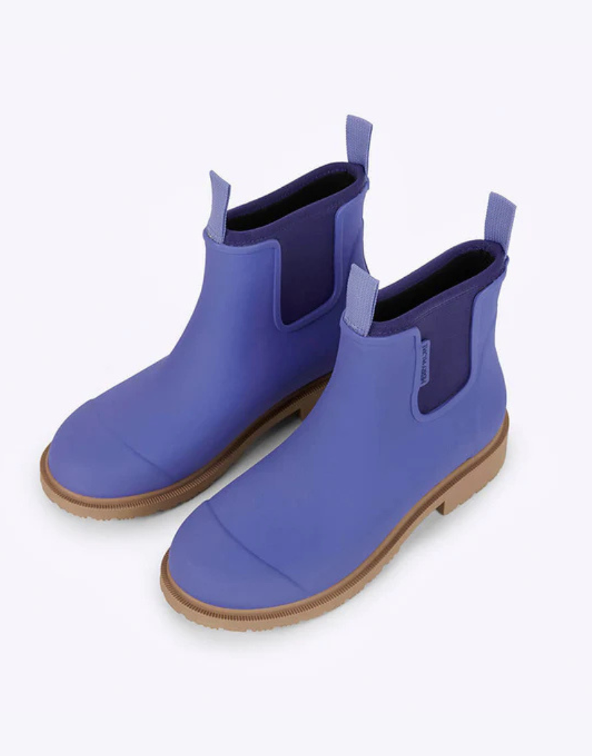 Violet and blue Merry People Bobbi gumboots with floral pattern, waterproof rubber footwear for women.