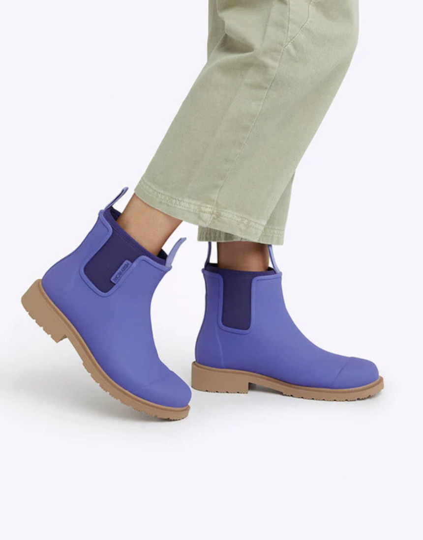 Violet and blue Merry People Bobbi gumboots with waterproof rubber soles, perfect for rainy weather and outdoor activities.