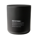 Hunter Lab Pinot Grape Skin Bath & Body soak with purple liquid in a clear glass jar, highlighting natural skincare ingredients