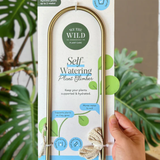 We The Wild self-watering plant climber with lush green foliage, designed to support climbing plants indoors or outdoors.