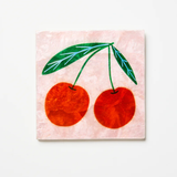 Jones & Co Superette Cherries Tile wall decor featuring a vibrant cherry pattern on ceramic tile.