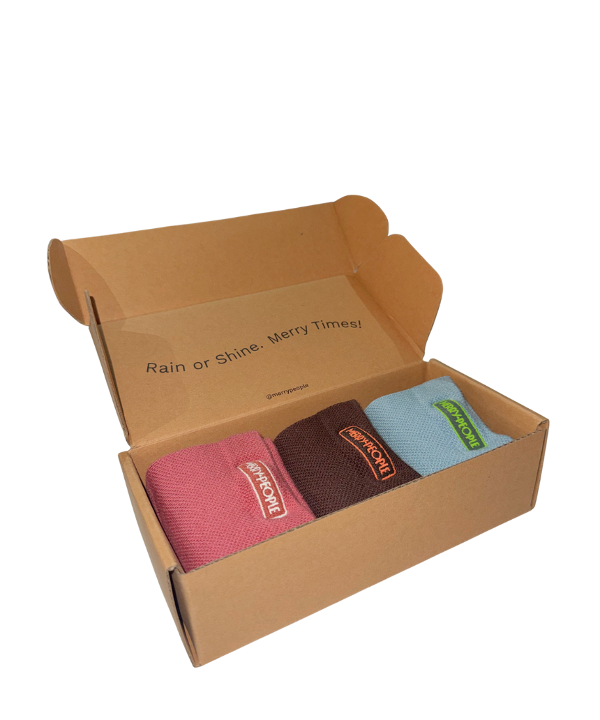 Set of three Merry People socks in colorful patterns, displayed in a box, perfect for gift-giving or everyday wear.