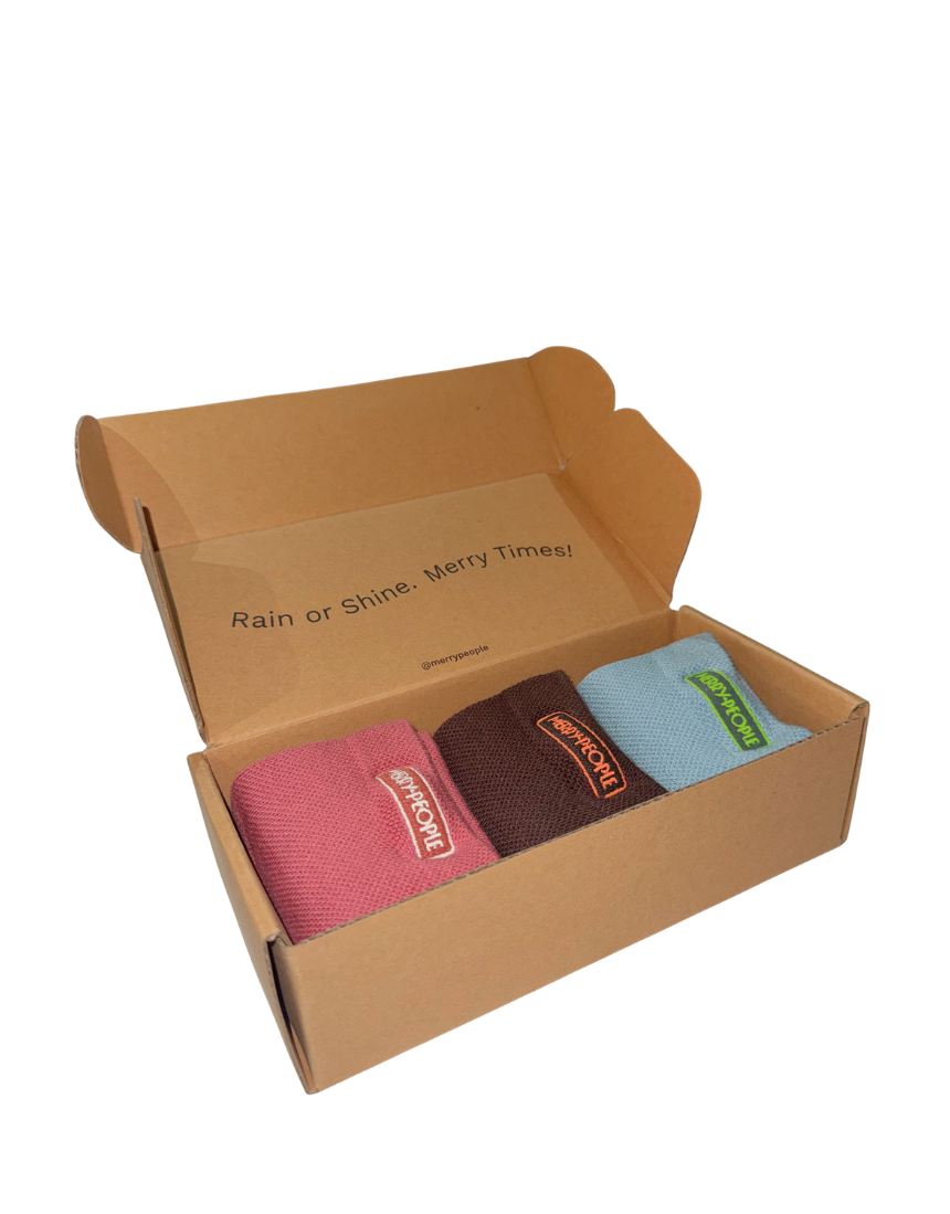 Set of three Merry People socks in colorful patterns, displayed in a box, perfect for gift-giving or everyday wear.
