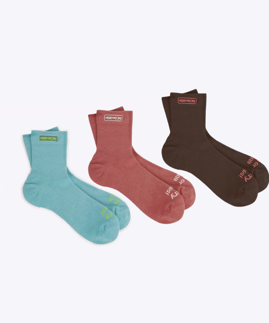Set of three Merry People socks in colorful patterns, featuring playful designs and cozy knit fabric.