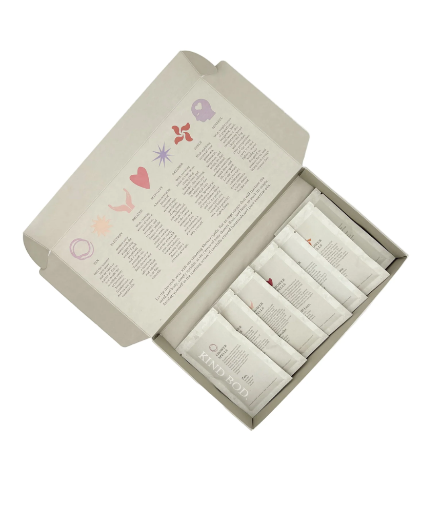 Kind Bod Shower Spell Discovery Set with colorful bath additives and natural ingredients for a relaxing shower experience.
