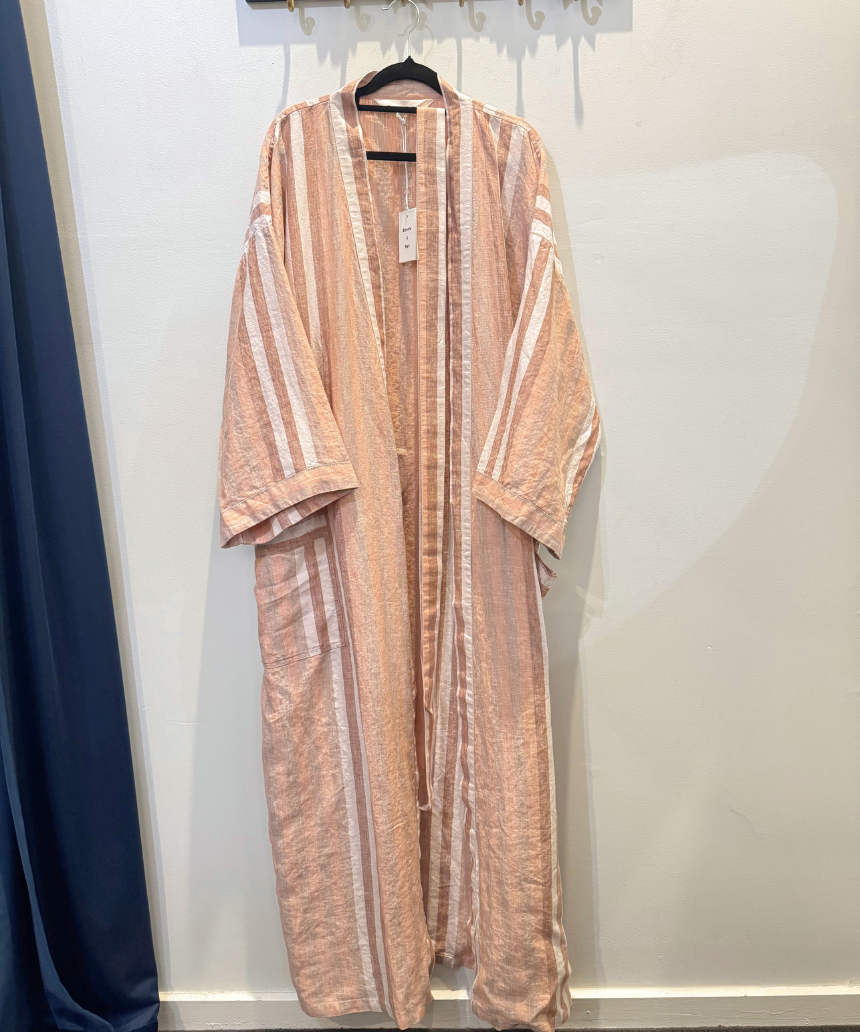 Bonnie and Neil Hazelnut Stripe Robe hanging on a wooden hook, featuring soft fabric and a cozy, stylish design.