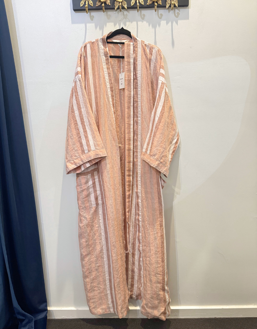 Bonnie and Neil Hazelnut Stripe Robe hanging on a wooden hook, featuring soft fabric and a cozy, stylish design.