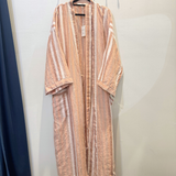 Bonnie and Neil Hazelnut Stripe Robe hanging on a wooden hook, featuring soft fabric and a cozy, stylish design.