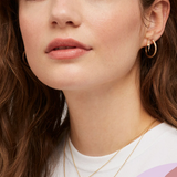 Estella Bartlett lightning bolt earrings with silver-tone finish, hanging design, and sleek, modern style.
