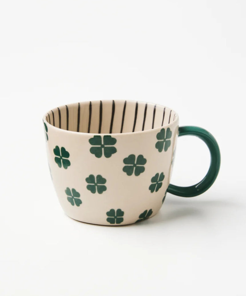 Jones & Co Chino Mug with "Lucky Me" print, featuring a ceramic mug with a cheerful design and bright colors.