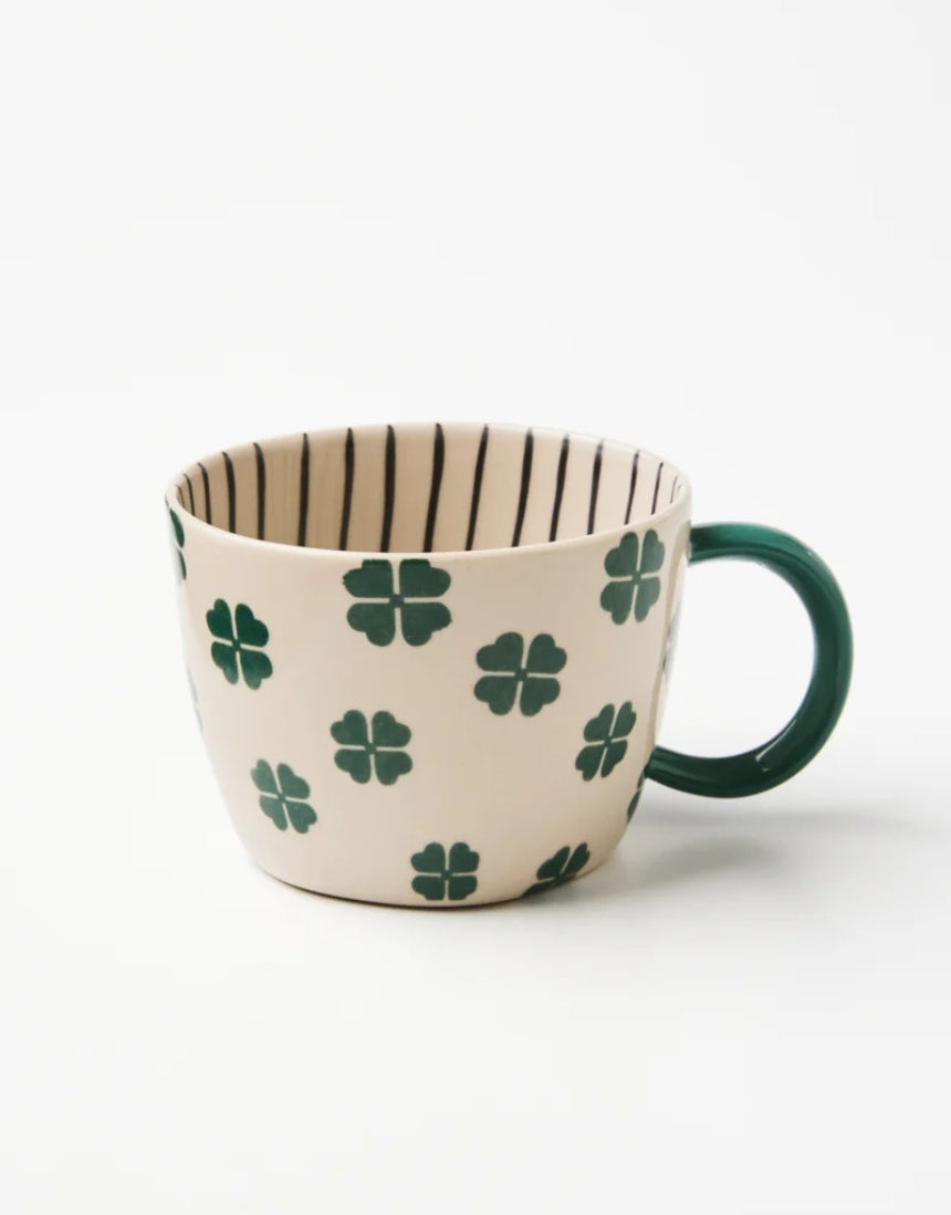 Jones & Co Chino Mug with "Lucky Me" print, featuring a ceramic mug with a cheerful design and bright colors.