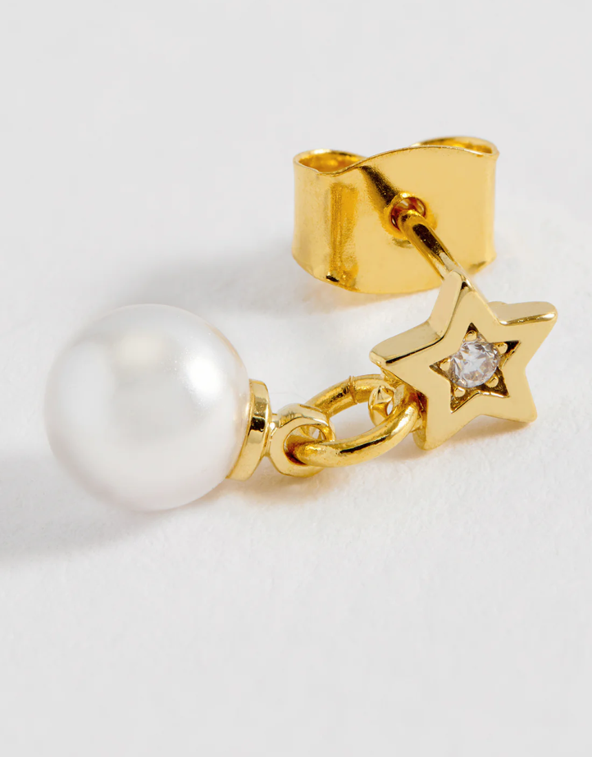 Estella Bartlett star and pearl stud earrings featuring delicate silver stars and elegant pearl accents on shiny metal posts.