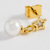 Estella Bartlett star and pearl stud earrings featuring delicate silver stars and elegant pearl accents on shiny metal posts.