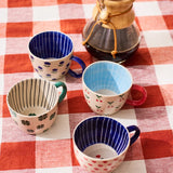 Jones & Co Chino Mug Mon Cherie featuring a stylish design, perfect for enjoying your favorite hot beverages.