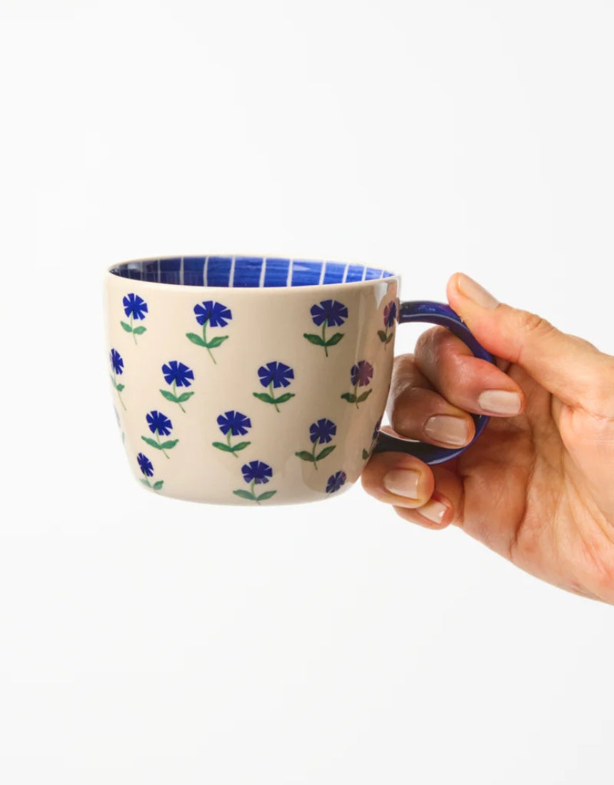 Jones & Co Chino Mug with Forget Me Knot design, featuring a stylish ceramic mug with elegant pattern and comfortable handle.