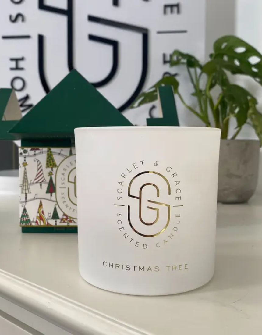 Large Scarlet & Grace Christmas Tree Candle with festive red and green wax, decorated with holiday-themed accents.