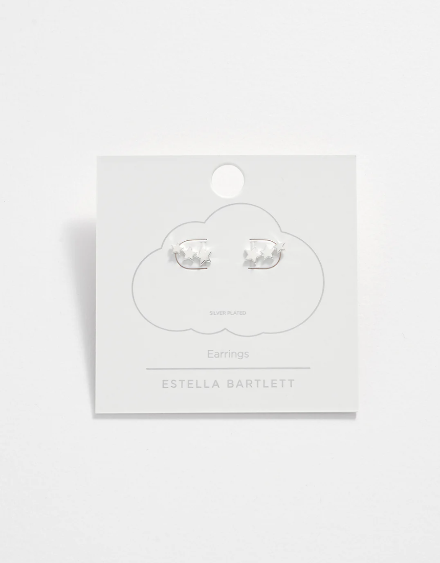 Estella Bartlett trio star stud earrings featuring three small star-shaped silver studs on a white background.