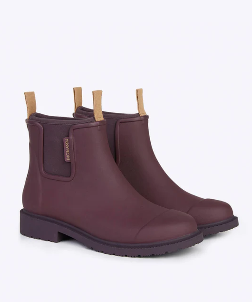 Dark cherry Merry People Bobbi gumboots with black rubber soles, stylish waterproof footwear for rainy days.